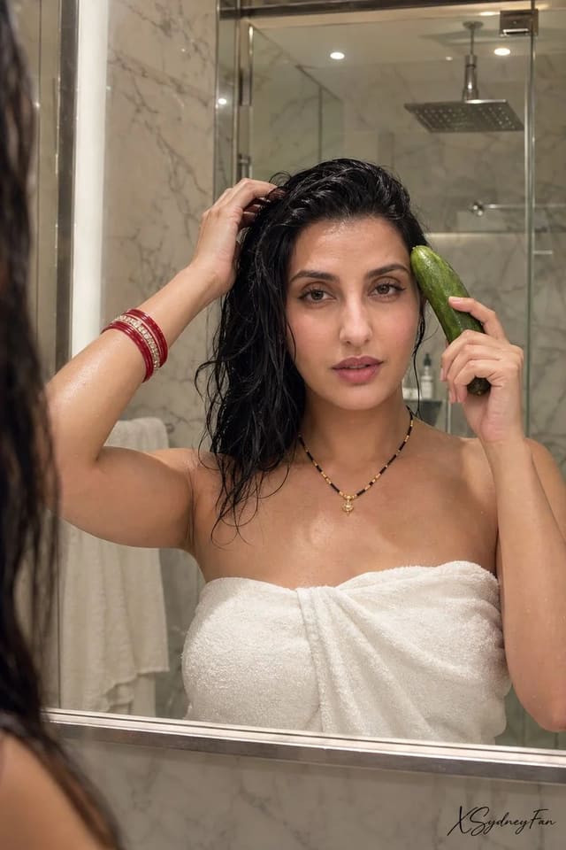 South Asian woman in luxury bathroom mirror reflection
