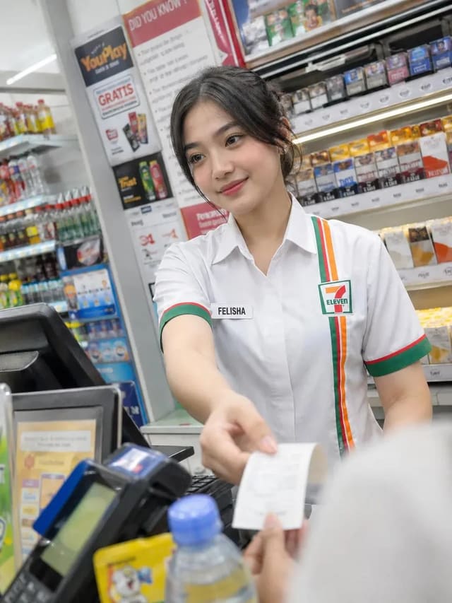 Candid convenience store cashier portrait