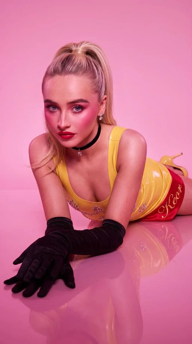 Glamorous Blonde Woman in Yellow Latex Mini Dress