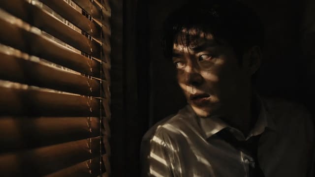 Dark Cinematic Thriller Still of a Man Hiding by Wooden Blinds