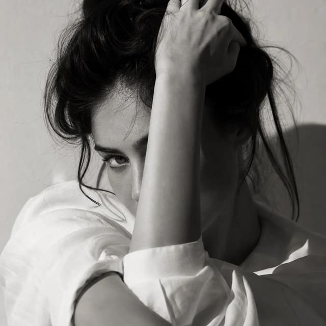 Black-and-white high-fashion editorial portrait