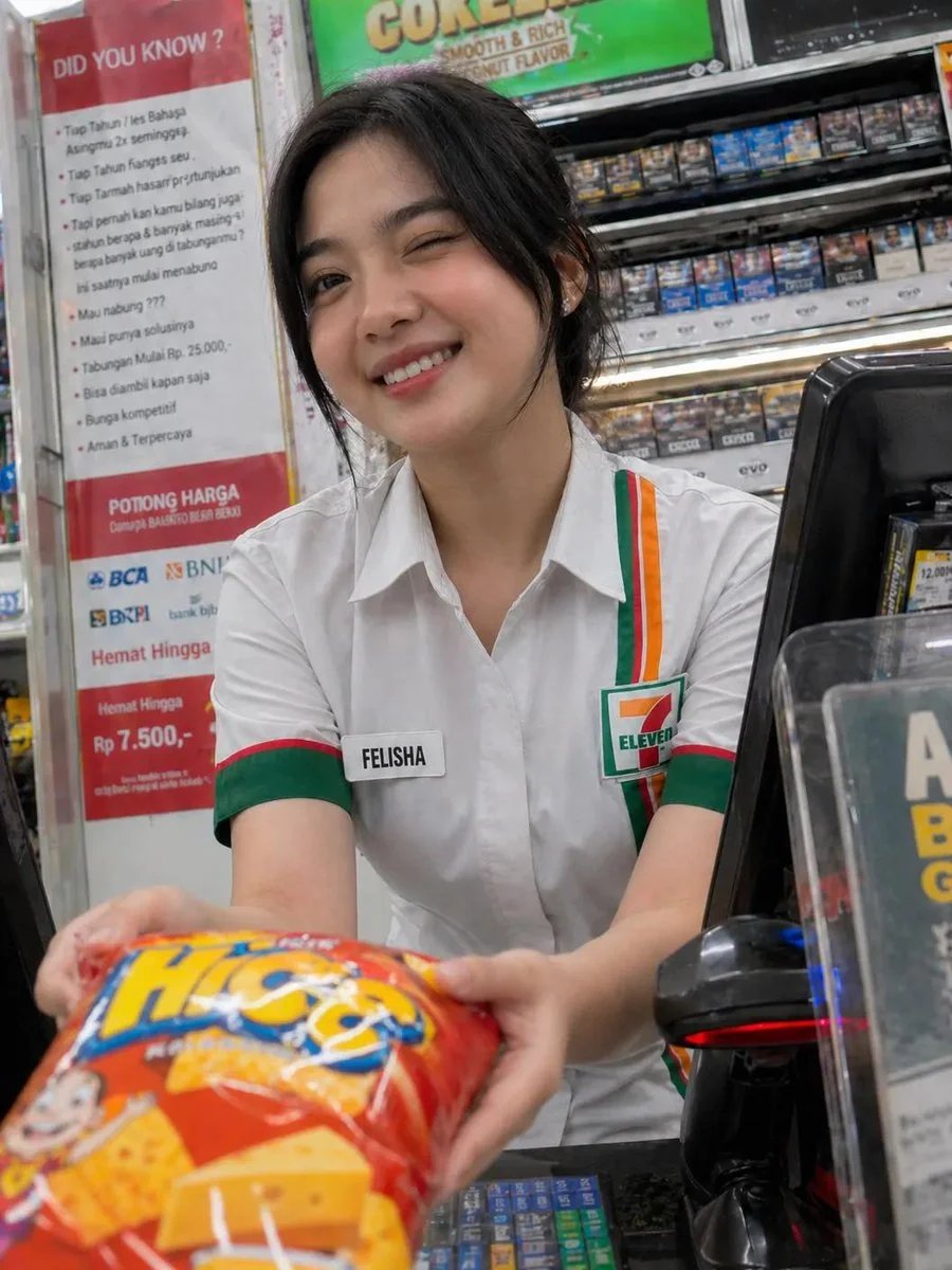 Candid convenience store cashier portrait