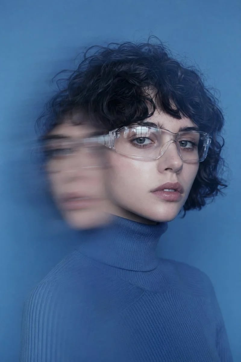 Futuristic editorial portrait with double-exposure motion blur