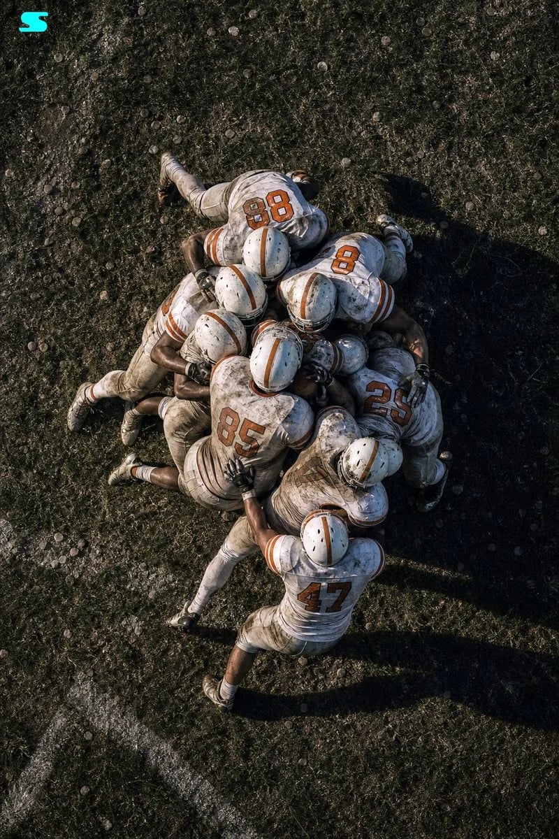 GPT Image 2 cinematic aerial football tackle huddle