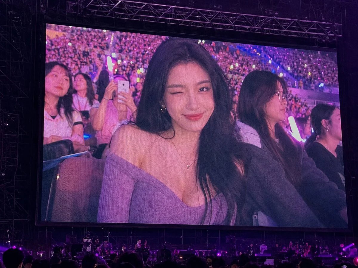 Photorealistic concert jumbotron fan-cam portrait prompt