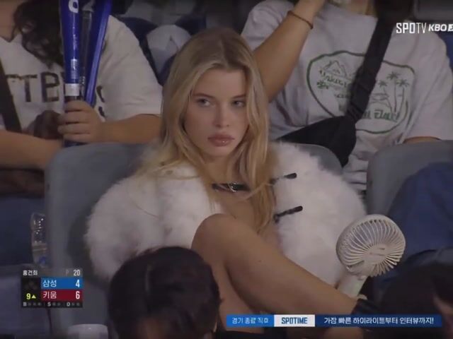 Ultra-Realistic Blonde Woman in Night Baseball Stadium